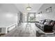 Spacious living room with hardwood floors and lots of natural light, perfect for entertaining at 5305 Traditions Rd, Indianapolis, IN 46235