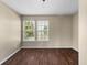 Bedroom featuring hardwood floors, natural lighting from windows, and neutral walls at 5519 Apple Branch Way, Indianapolis, IN 46237