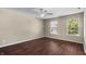 Bright bedroom with hardwood floors, neutral walls and natural light from two windows at 5519 Apple Branch Way, Indianapolis, IN 46237