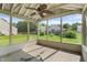 Covered porch with ceiling fan, and views of the backyard at 5519 Apple Branch Way, Indianapolis, IN 46237