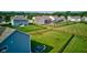 Aerial view of the backyard featuring a large grassy area with a black metal fence at 5527 Mahogany Dr, Noblesville, IN 46062