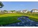 Spacious backyard with a paved patio area and inviting fire pit perfect for entertaining at 5527 Mahogany Dr, Noblesville, IN 46062