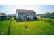 Expansive backyard with a well-maintained lawn and a charming patio area at 5527 Mahogany Dr, Noblesville, IN 46062