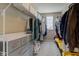 A walk-in closet is equipped with wire shelving, drawers, and ample hanging storage at 5527 Mahogany Dr, Noblesville, IN 46062