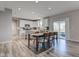 Open layout shows the dining area, kitchen, and access to the backyard through sliding glass doors at 5527 Mahogany Dr, Noblesville, IN 46062