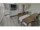 Elegant dining area with a wooden table set for a meal, and adjacent view into the living room at 5527 Mahogany Dr, Noblesville, IN 46062
