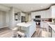 Open kitchen with island, stainless appliances, hardwood floors, and eat in dining space at 5527 Mahogany Dr, Noblesville, IN 46062
