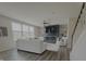 Bright living room with modern fireplace, neutral decor, and large windows for natural light at 5527 Mahogany Dr, Noblesville, IN 46062