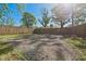 Long gravel driveway leading to a wooden fence and gate in the backyard at 555 N Oakland Ave, Indianapolis, IN 46201