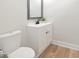 Clean bathroom with a white vanity, modern fixtures, and neutral decor at 555 N Oakland Ave, Indianapolis, IN 46201