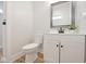Neat bathroom with a white vanity, modern fixtures, and neutral decor at 555 N Oakland Ave, Indianapolis, IN 46201