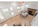 Aerial view of the dining room featuring hardwood floors, a fireplace, and natural light at 555 N Oakland Ave, Indianapolis, IN 46201