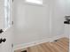 Bright entryway featuring a decorative front door and hardwood floors at 555 N Oakland Ave, Indianapolis, IN 46201