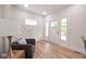 Bright foyer with view of the entry door and staircase with natural light at 555 N Oakland Ave, Indianapolis, IN 46201