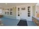 Inviting front porch featuring a stylish front door with sidelights at 555 N Oakland Ave, Indianapolis, IN 46201