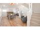 Bright living room featuring hardwood floors, a fireplace, and a staircase at 555 N Oakland Ave, Indianapolis, IN 46201