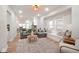 Open concept living room features window nook, and blends seamlessly into the dining area at 555 N Oakland Ave, Indianapolis, IN 46201