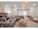 Relaxing living room with a brick fireplace, window seat, and ample natural light at 555 N Oakland Ave, Indianapolis, IN 46201