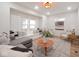 Comfortable living room with a window nook, stylish furnishings, and wood flooring at 555 N Oakland Ave, Indianapolis, IN 46201