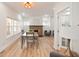 Bright living room featuring hardwood floors, a fireplace, and lots of windows at 555 N Oakland Ave, Indianapolis, IN 46201