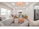 Cozy living room with large windows, built-in bench seating, and modern decor at 555 N Oakland Ave, Indianapolis, IN 46201