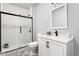Modern bathroom with glass enclosed shower, and a white vanity at 5678 N College Ave, Indianapolis, IN 46220