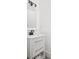 Bathroom vanity with a white quartz countertop, undermount sink, and shaker-style cabinet doors at 5678 N College Ave, Indianapolis, IN 46220