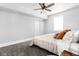 Bedroom with neutral color palette, a ceiling fan and carpet at 5678 N College Ave, Indianapolis, IN 46220