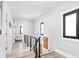 Second floor hallway features neutral walls, black framed windows, and modern railings at 5678 N College Ave, Indianapolis, IN 46220