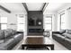 Bright living room with fireplace, plush seating, and a modern aesthetic at 5678 N College Ave, Indianapolis, IN 46220
