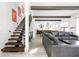 Open-concept living area with wood floors, modern decor, and lots of natural light at 5678 N College Ave, Indianapolis, IN 46220