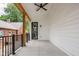 Covered porch with fan and dark metal railings at 5678 N College Ave, Indianapolis, IN 46220