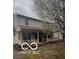 Charming two-story home with a welcoming front porch and mature flowering tree at , Indianapolis, IN 46254
