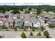 An aerial view of a well-planned neighborhood featuring manicured lawns and mature trees at 5832 Buskirk Dr, Indianapolis, IN 46216