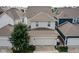 A bird's-eye view of a lovely home featuring an attached garage and neatly manicured surroundings at 5832 Buskirk Dr, Indianapolis, IN 46216