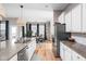 Open kitchen with stainless steel appliances and a view of the dining area at 5832 Buskirk Dr, Indianapolis, IN 46216