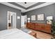 Main bedroom with hardwood floors, neutral walls, and stylish decor at 5832 Buskirk Dr, Indianapolis, IN 46216