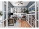 A stylish home office featuring custom shelving, a modern desk, and lots of natural light at 5832 Buskirk Dr, Indianapolis, IN 46216