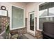 Covered brick patio with outdoor seating at 5832 Buskirk Dr, Indianapolis, IN 46216