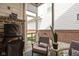 Screened in patio with outdoor seating and brick at 5832 Buskirk Dr, Indianapolis, IN 46216