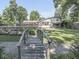 Serene backyard featuring lush greenery and a rustic wooden walkway leading to a relaxing outdoor space at 6019 S Tacoma Ave, Indianapolis, IN 46227