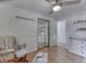 Comfortable Bedroom boasting hardwood floors and a rocking chair at 6019 S Tacoma Ave, Indianapolis, IN 46227