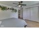 Inviting bedroom featuring hardwood floors, a ceiling fan, and a closet at 6019 S Tacoma Ave, Indianapolis, IN 46227