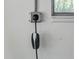 Tesla charging station mounted on the wall, providing convenient at-home charging at 6019 S Tacoma Ave, Indianapolis, IN 46227