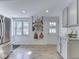 Bright kitchen with stainless steel refrigerator and granite countertops, offering functionality and style at 6019 S Tacoma Ave, Indianapolis, IN 46227