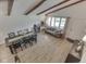 Open-concept living room featuring dining area, wood floors, and natural light at 6019 S Tacoma Ave, Indianapolis, IN 46227
