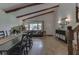 Living room featuring exposed wood beams, large windows, and elegant decor at 6019 S Tacoma Ave, Indianapolis, IN 46227