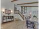 Open-concept living room featuring staircase, sleek storage, and comfortable seating at 6019 S Tacoma Ave, Indianapolis, IN 46227