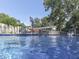 Sparkling in-ground pool with basketball hoop and diving board, perfect for summer fun and relaxation at 6019 S Tacoma Ave, Indianapolis, IN 46227