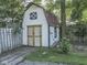 Charming shed with double doors and fresh paint, great for storage or workshop at 6019 S Tacoma Ave, Indianapolis, IN 46227